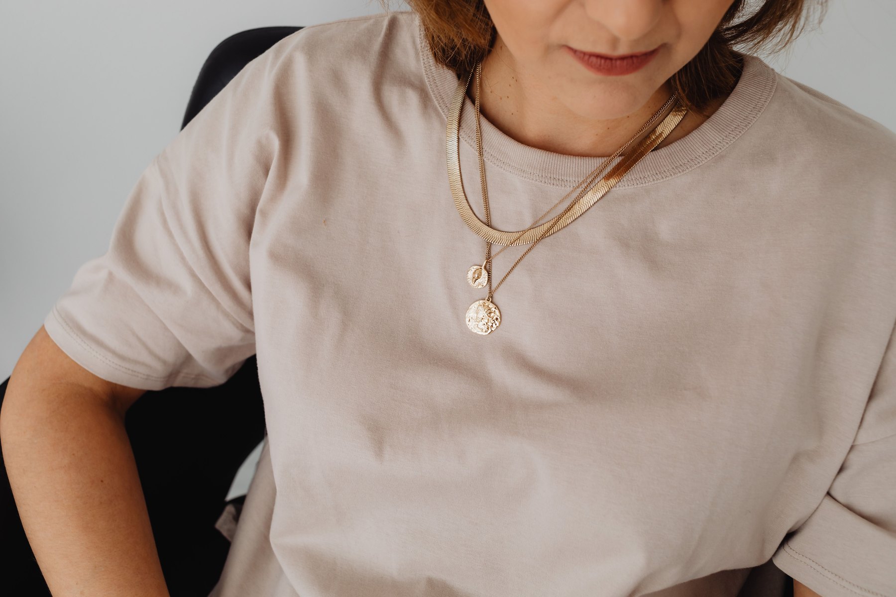 Editorial portrait featuring gold fashion accessories