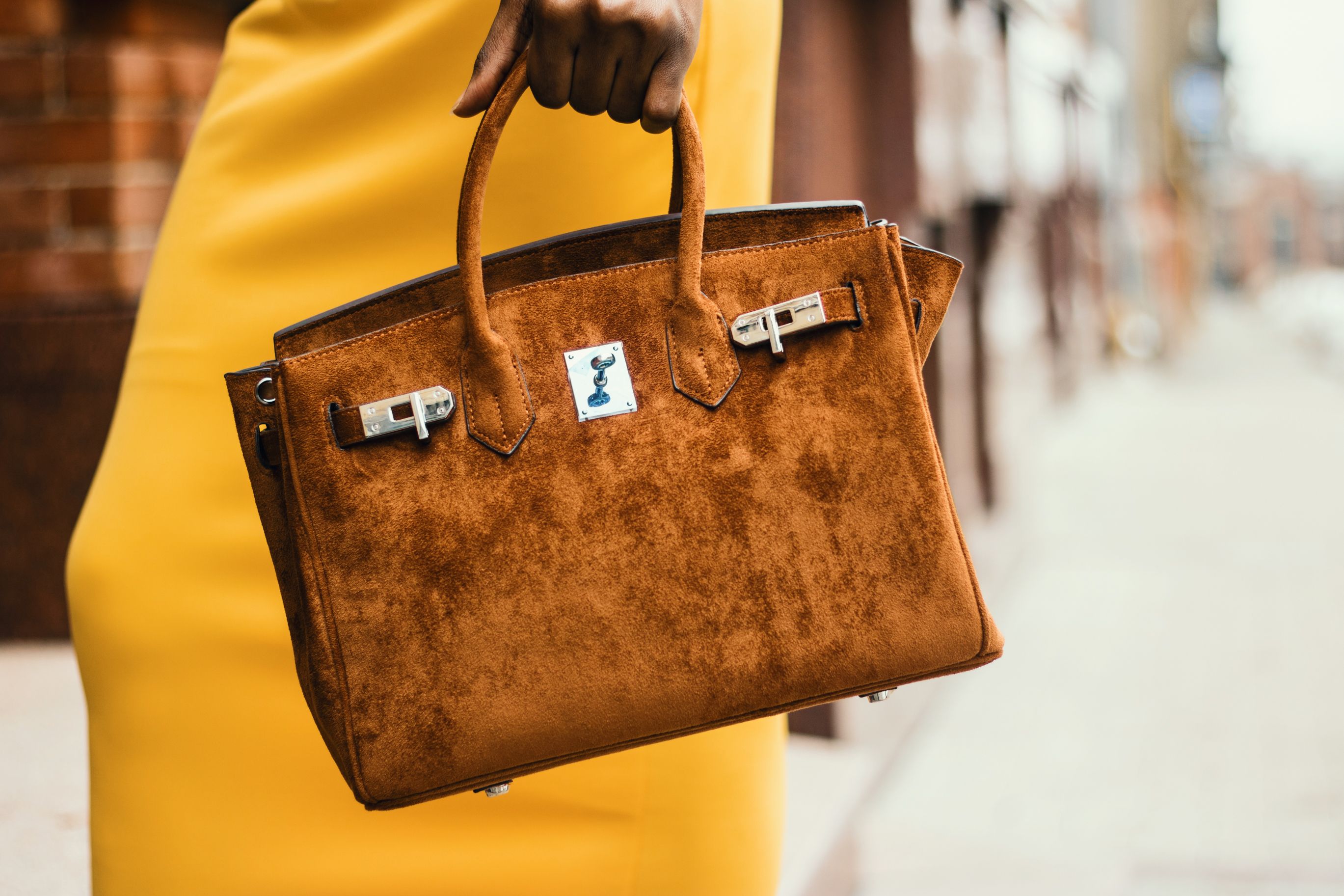 Brown leather tote styled in an urban fashion setting